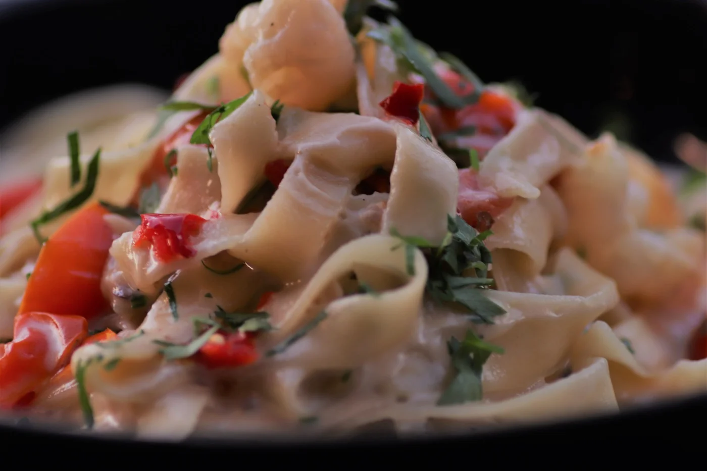 Creamy ribbon pasta with herbs and capsicum